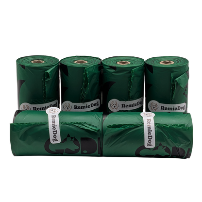 Six rolls of green dog waste bags with RemieDog branding on a white background
